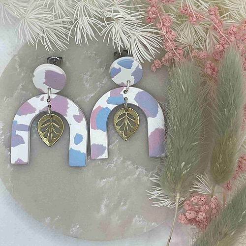 arched earrings with metal leaf