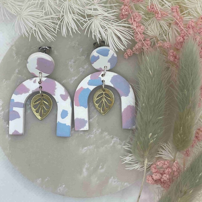 arched earrings with metal leaf