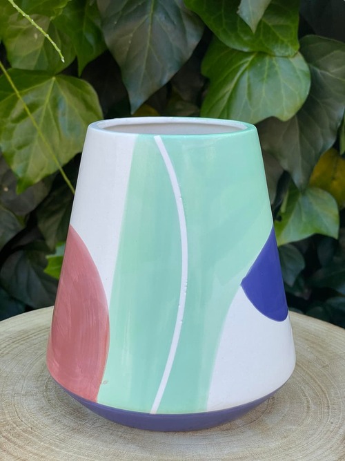 green, red, white and blue vase